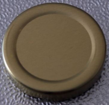 TO 53 gold past. Twist_Off lid, cap, stopper